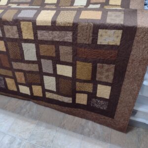 quilt draped over furniture