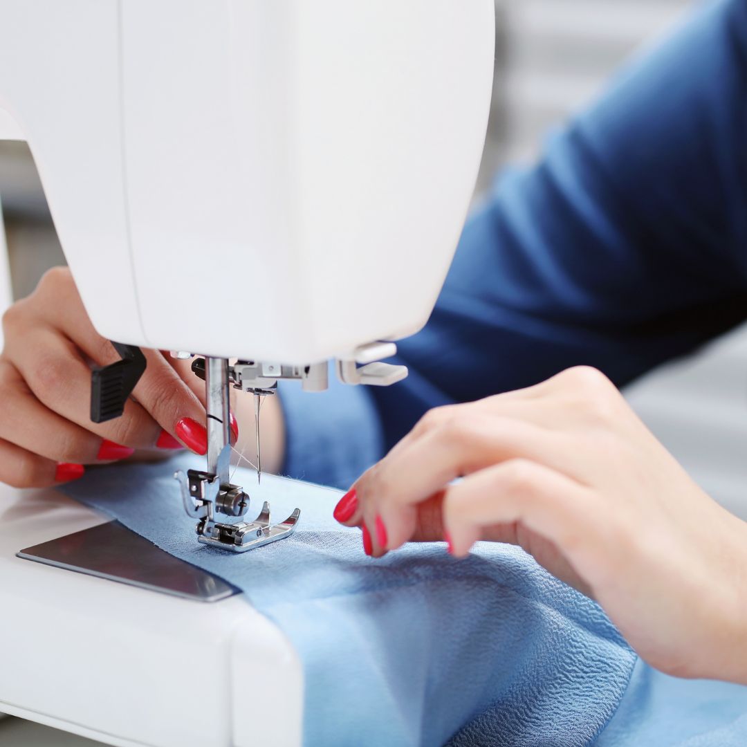 showing a person using a sewing machine